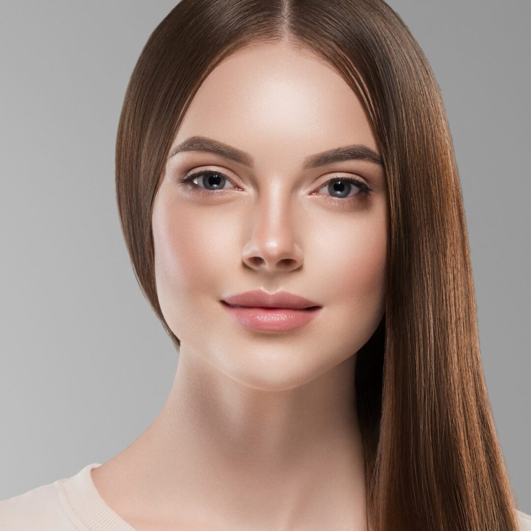 Smooth long brunette hair woman face close up